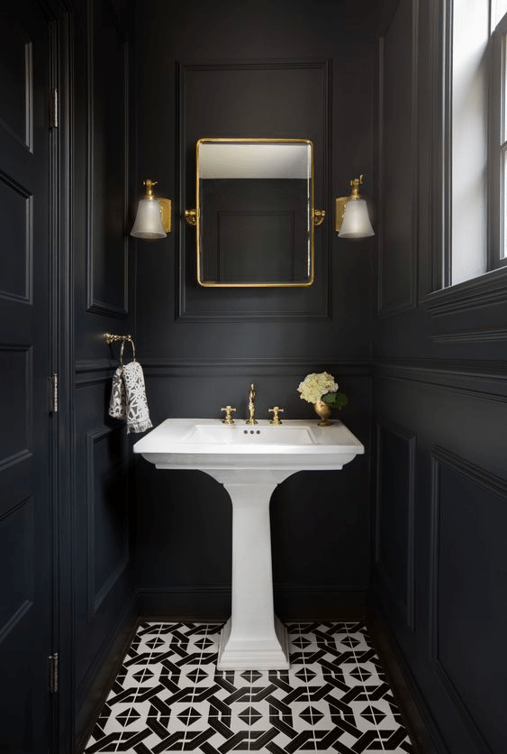 This room is designed with a black wood finish and elegant classic details. It provides a comfortable and private space for toileting.