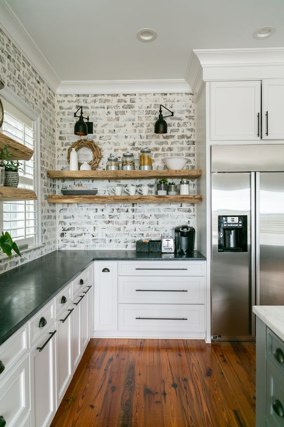 Working with a custom home builder ensured this Lowcountry kitchen was carefully constructed with unique details such as the brick backsplash with German smear