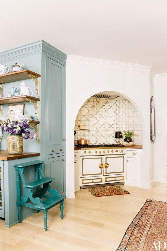 A Moroccan tile backsplash is perfectly coordinated to Elson’s ivory and cream La Cornue range in the kitchen | archdigest.com